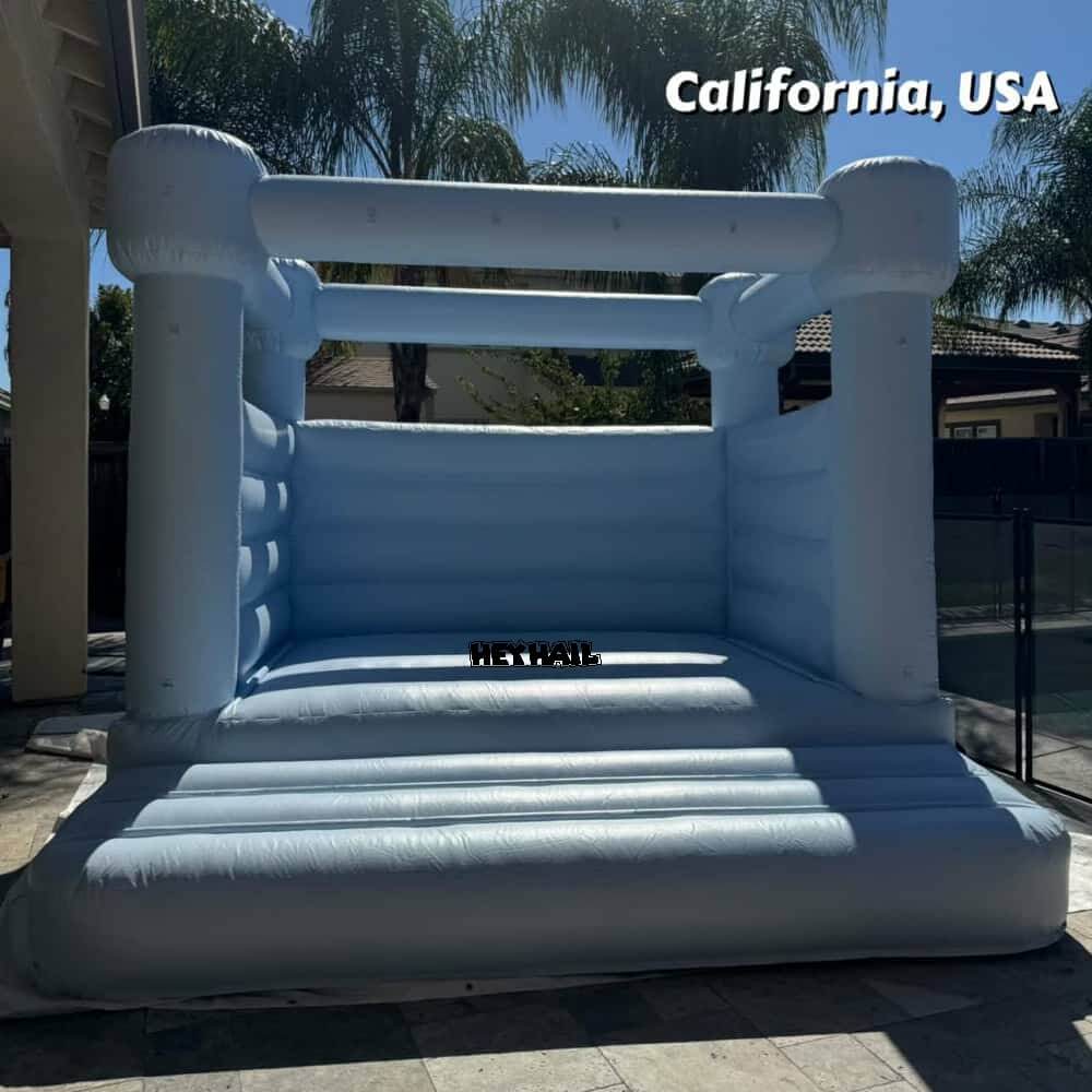 light pastel blue 10ft bounce house at a customer setup