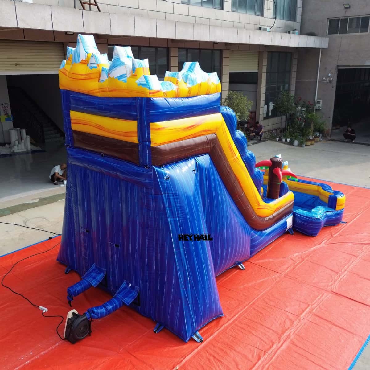 Rear view of 16ft mountain water slide with inflation tubes