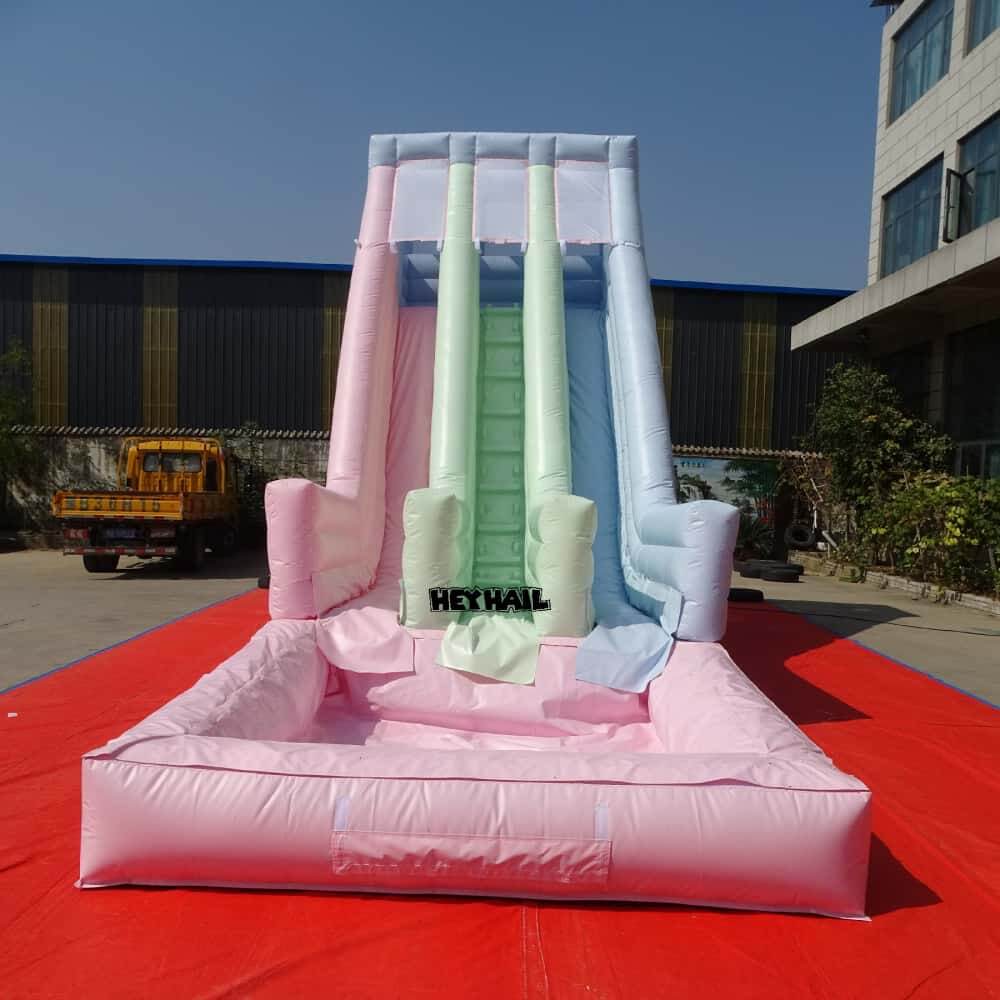Pastel dual lane water slide front view with splash pool and side rails