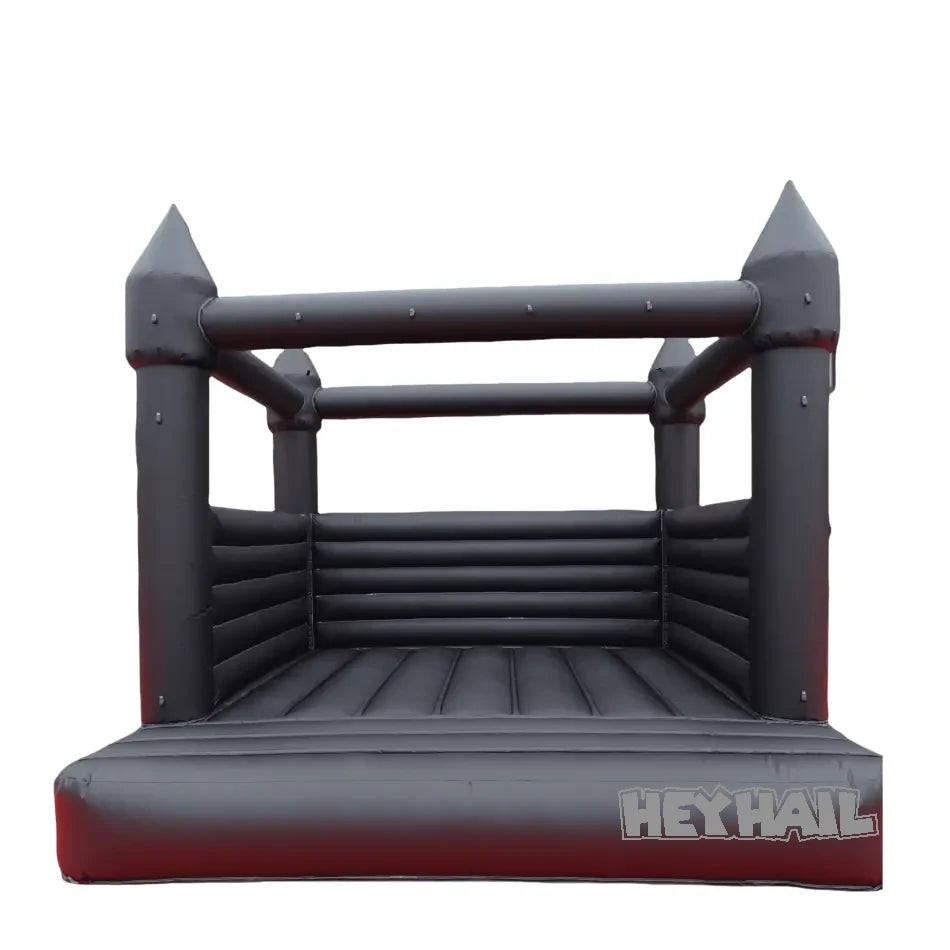Front view of black 13x13ft inflatable bounce house with pointed castle turrets and mesh side panels