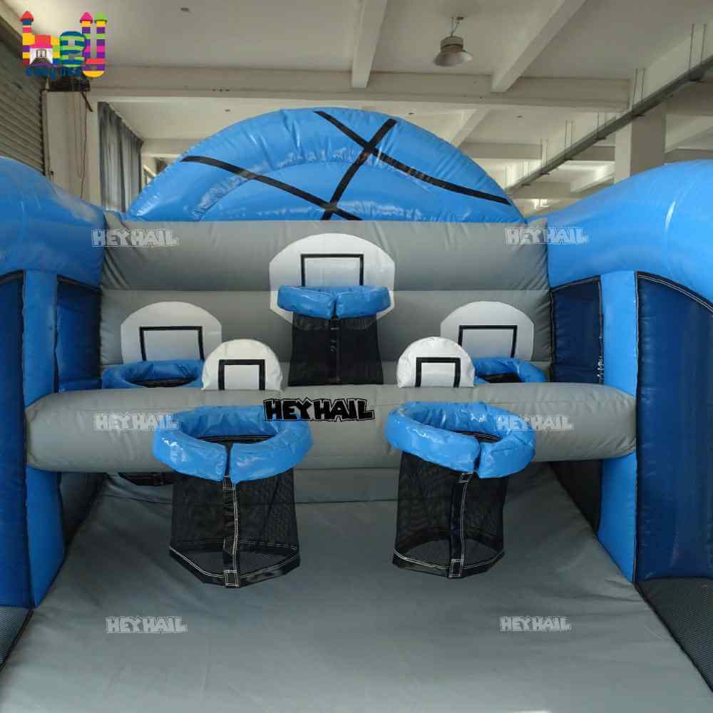 Factory view of three basketball hoops beneath the blue basketball-themed top