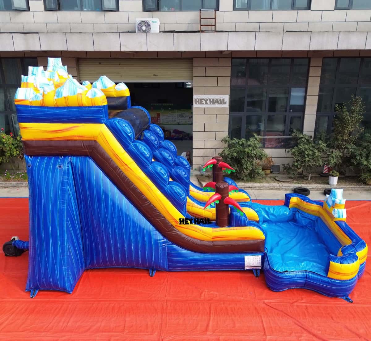 Side view of 16ft mountain water slide and splash pool