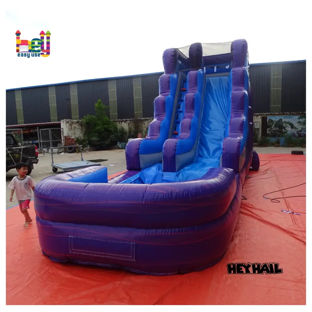 Outdoor front view of marble blue and marble purple 16ft single-lane water slide with attached pool and blue slide lane
