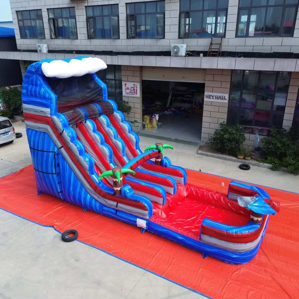 20ft blue and red dual-lane water slide with pool, angled front view