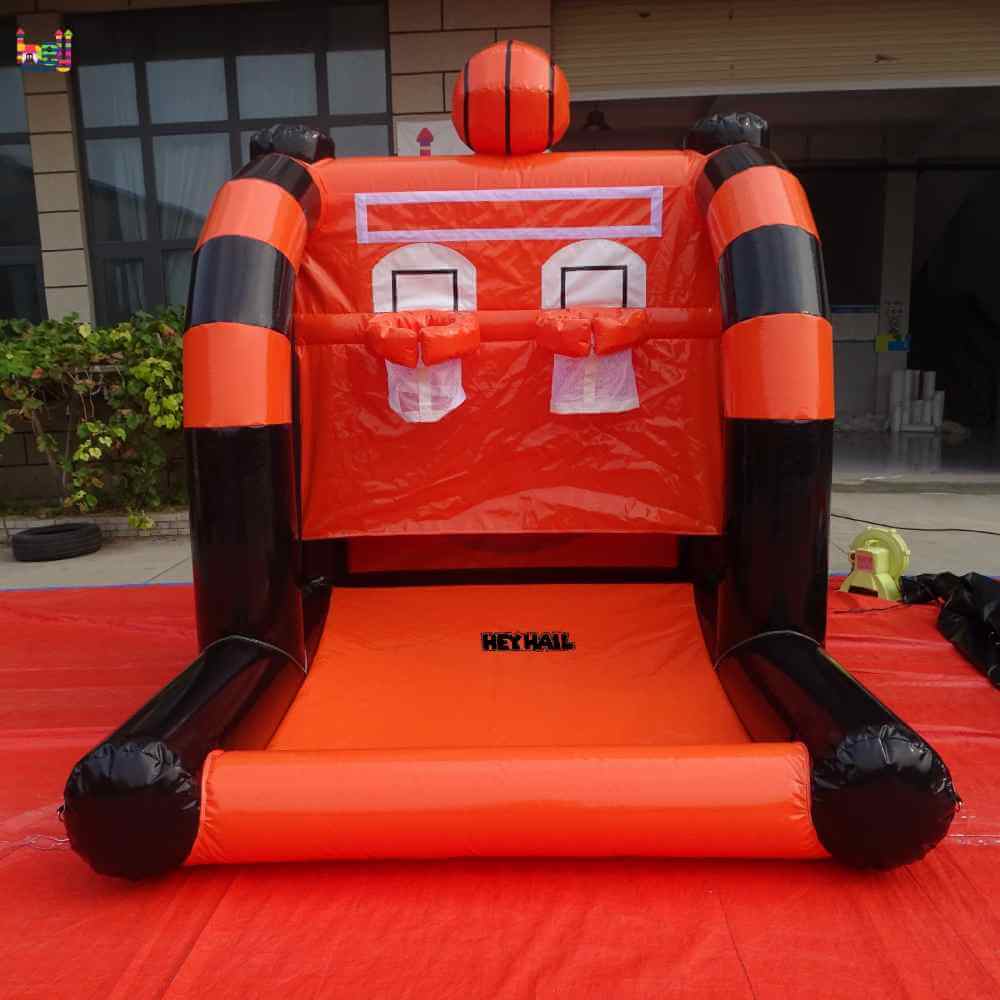Front view of inflatable basketball hoop game showing two net baskets and basketball-shaped top decoration