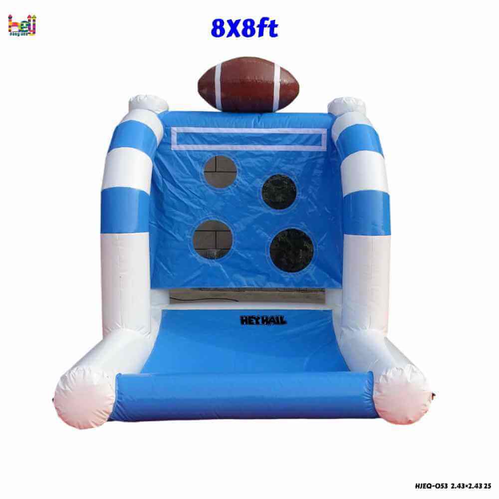 Front view of blue-and-white inflatable football toss game with four target openings