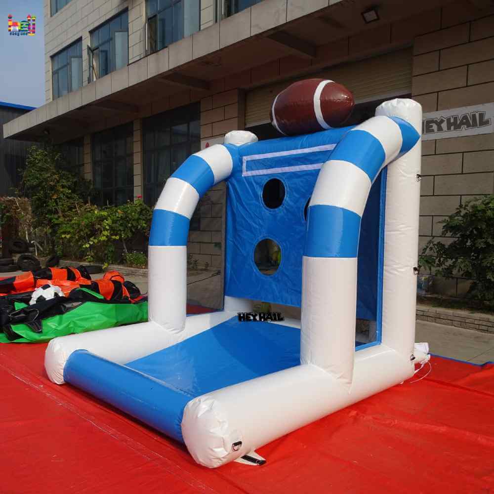 Side angled view of blue-and-white football toss game showing mesh side panel