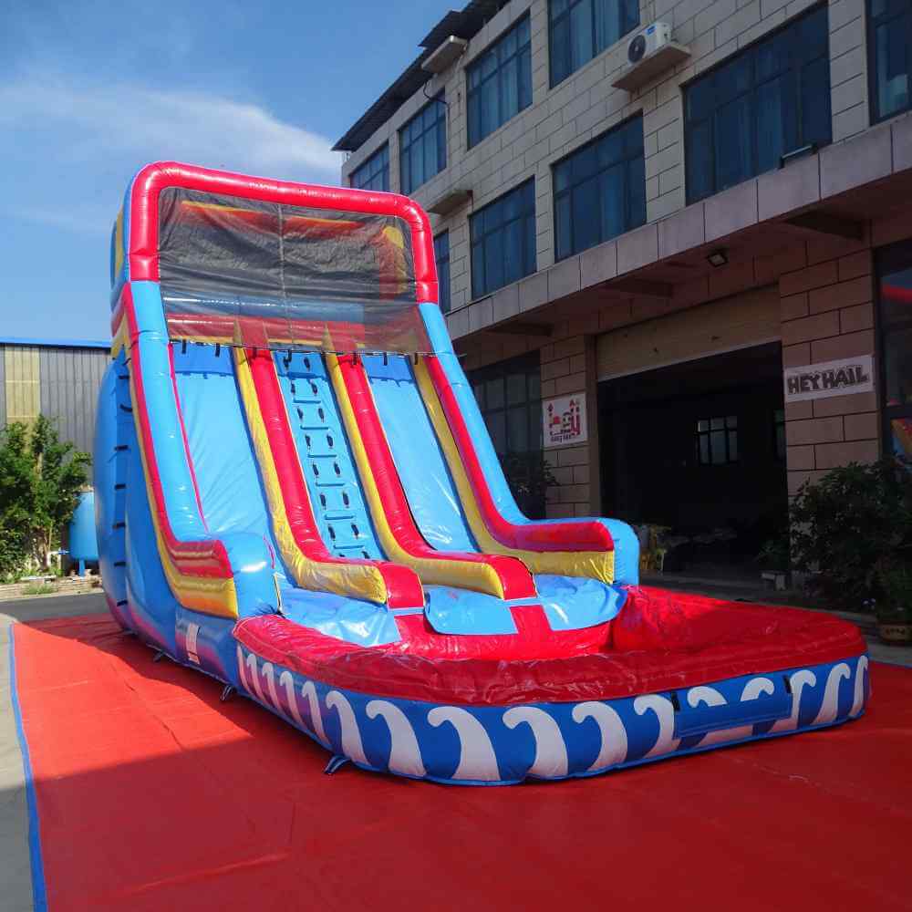 Front view of red blue yellow 22ft dual lane water slide with attached deep pool