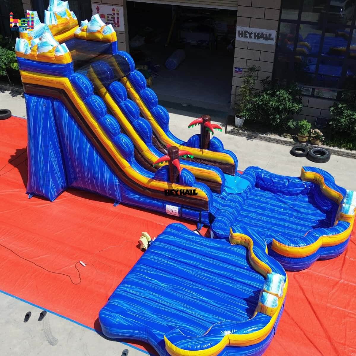 Side view of 18ft blue mountain commercial water slide with pool