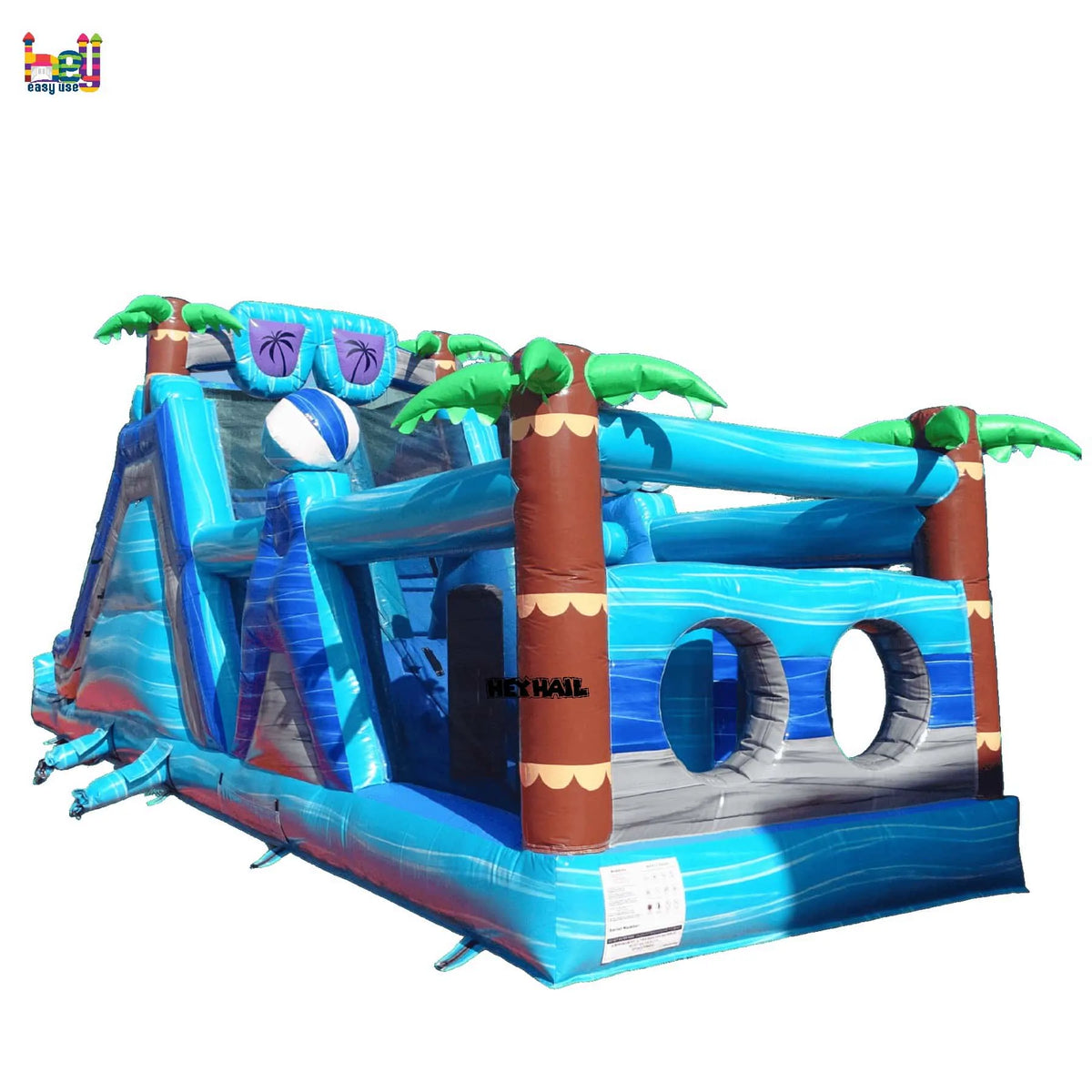 Rear-left view of the tropical dual-lane inflatable obstacle course with a slide