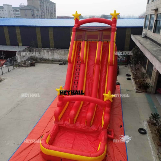 Red and yellow 31ft dual-lane commercial water slide with splash pool, front view