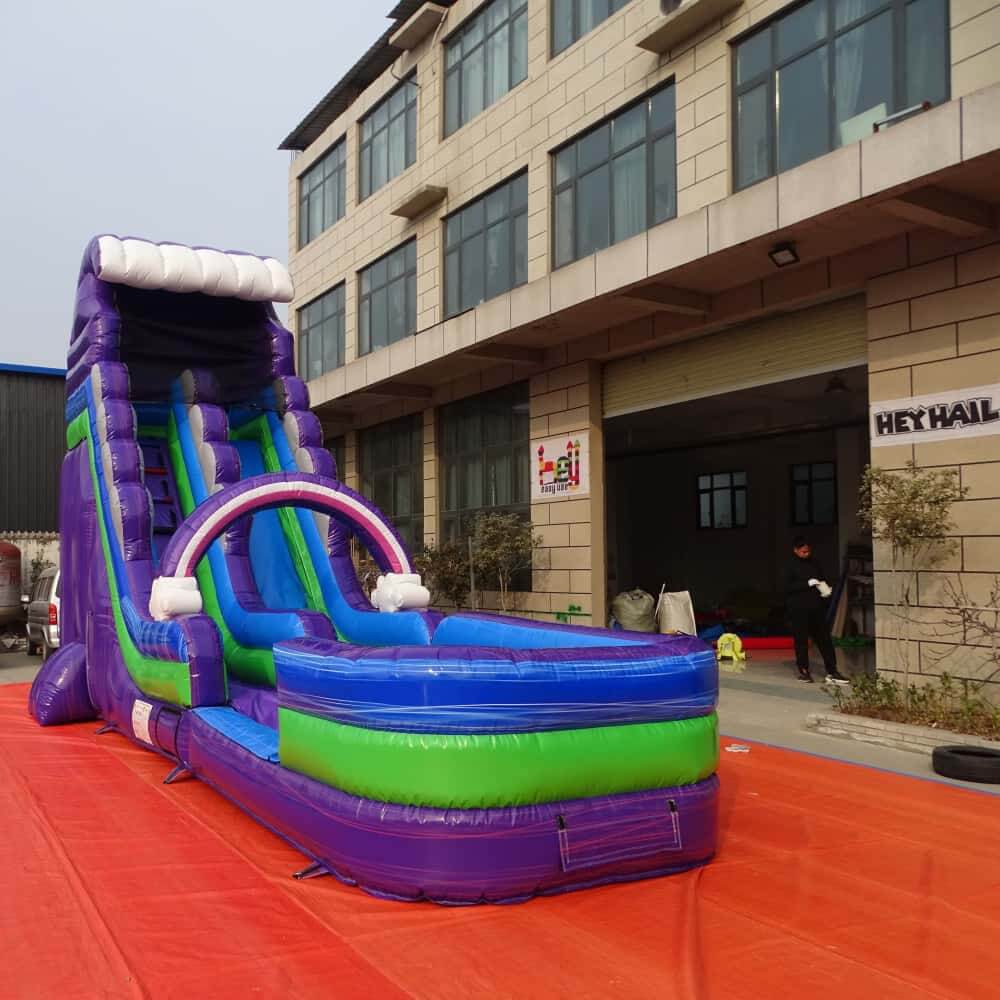 Purple single lane water slide with pool outside the HEYHAIL factory
