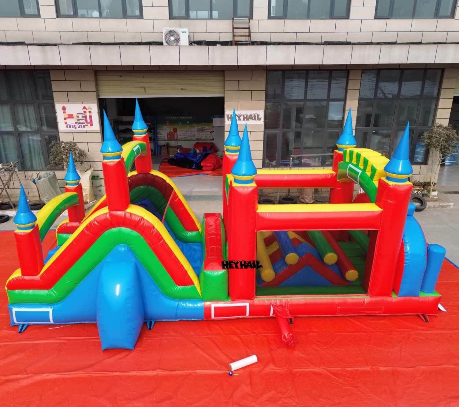 Inflated HEYHAIL obstacle course shown at a factory setup