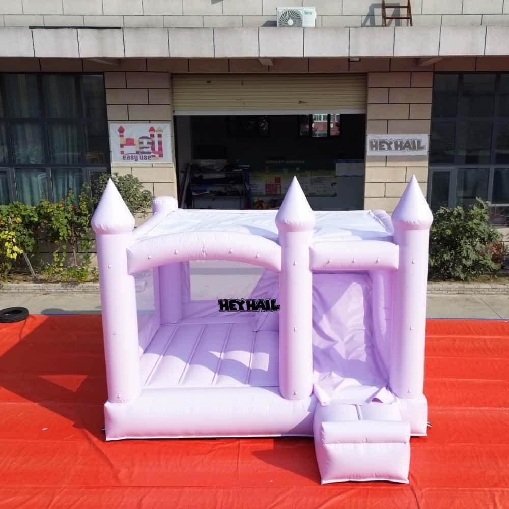 Front view of lavender 13 x 13 ft bounce house with slide