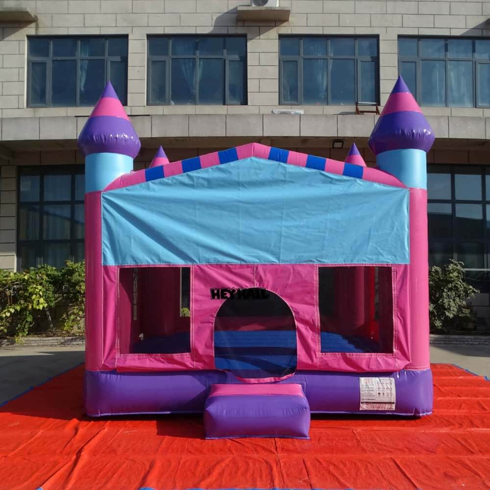 Pink 13 x 13 ft regular bounce house front view with mesh windows